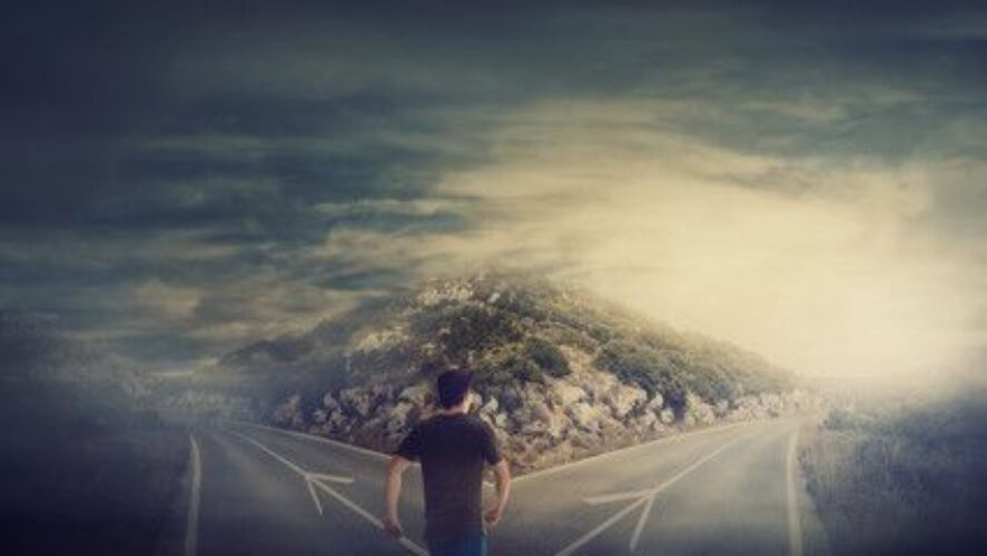 why high achievers feel empty - man at crossroads choosing a new path forward