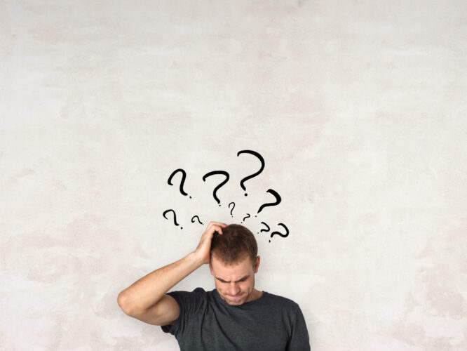 Young man thinking and confused - self-reflection